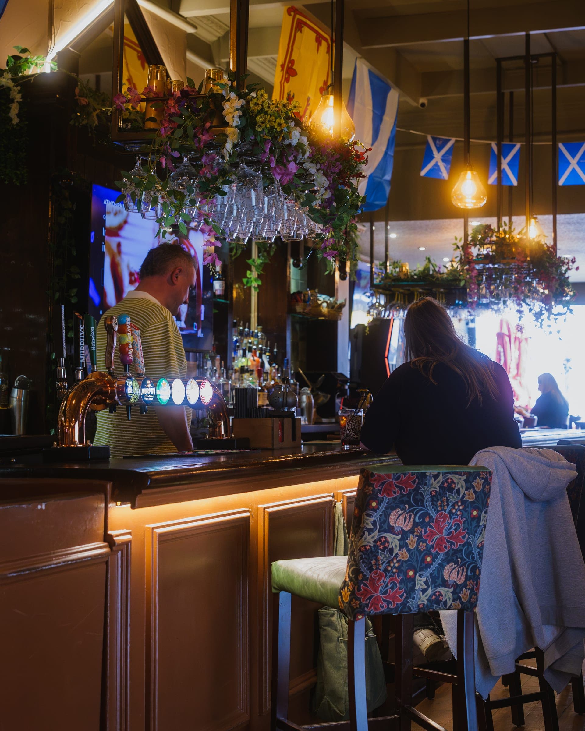 Bar and customers at The Tilted Wig